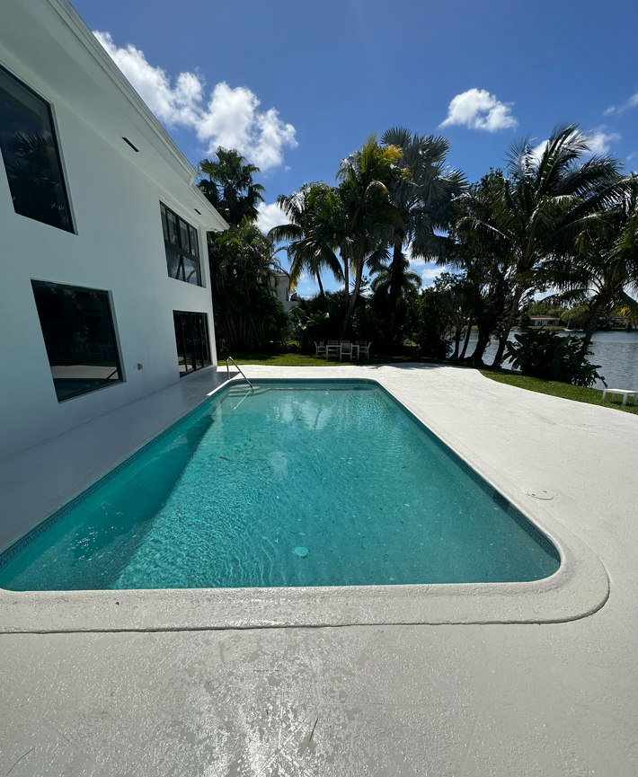 Affordable plain concrete deck solution for residential backyards in Miami