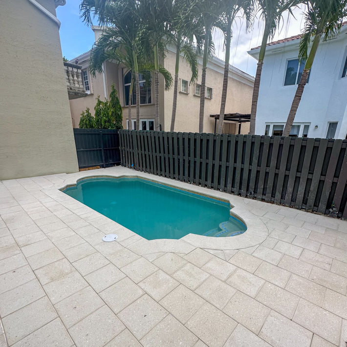 Brick paver deck professionally installed for a durable and stylish backyard in Miami