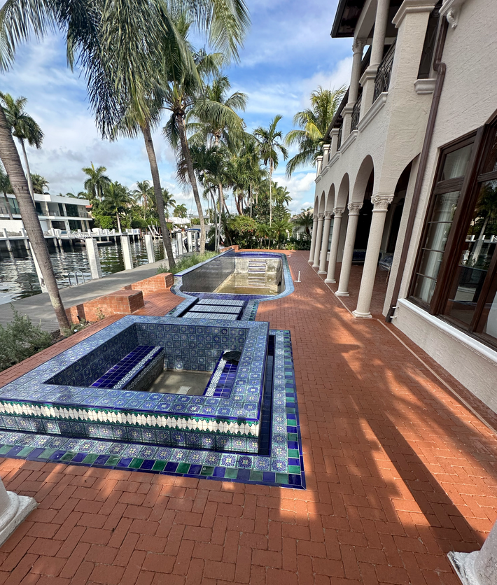 Pool deck built with brick pavers offering a non-slip and elegant finish in Miami