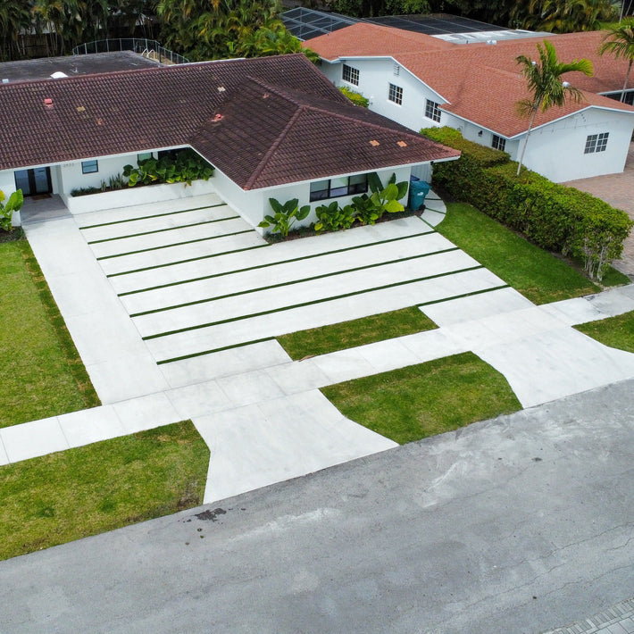 Custom decorative driveway design combining pattern and color for Florida properties