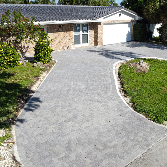 Interlocking driveway pavers installed to enhance curb appeal in a Miami home