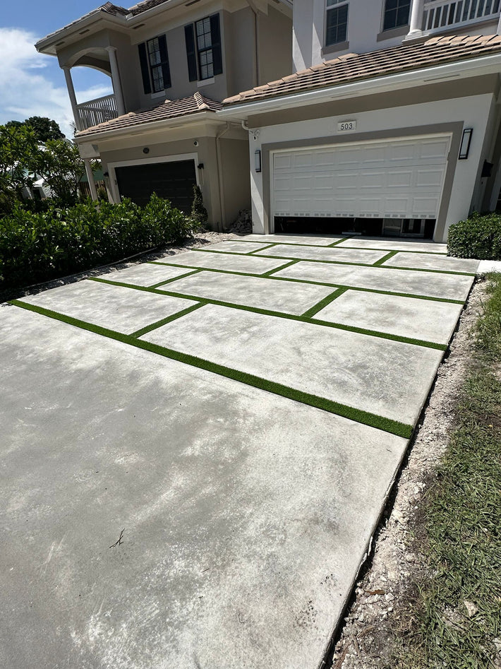 Elegant decorative driveway built with a combination of materials and patterns in Miami