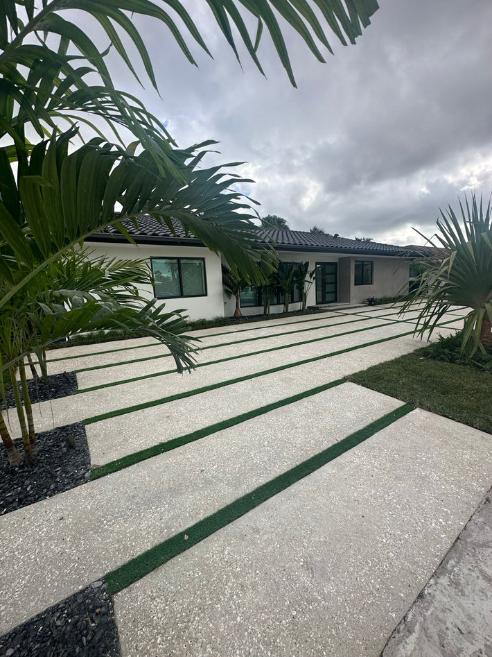 Concrete driveway with exposed aggregate finish built to withstand Florida weather