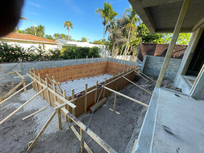Luxury pool construction with custom features and finishes in a Miami home

