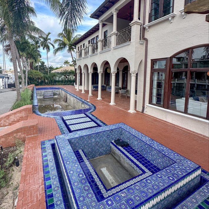 Pool deck installation using natural stone for a clean and timeless finish