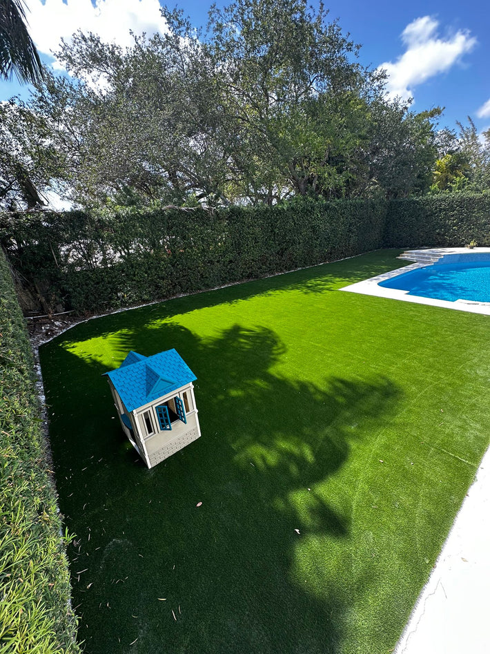 Outdoor patio designed with artificial turf for comfort, style, and visual appeal