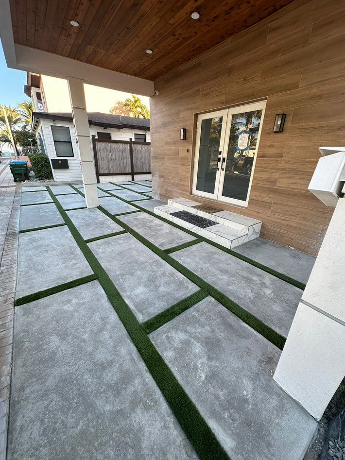 Patterned pavers installed for a decorative and durable driveway entrance