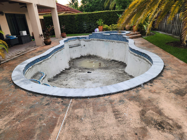 Pool upgraded with new coping and waterline tile for a refreshed look in Miami