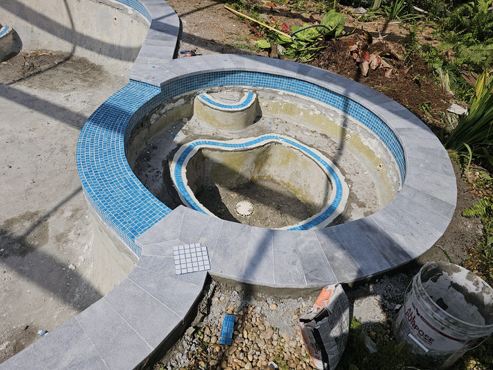 Multiple pool coping material options offered for custom pool finishes in Miami