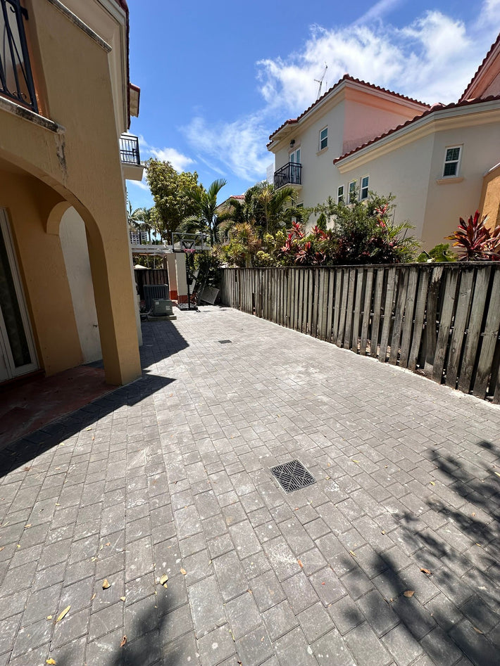 Brick paver deck installation for a residential backyard in Miami