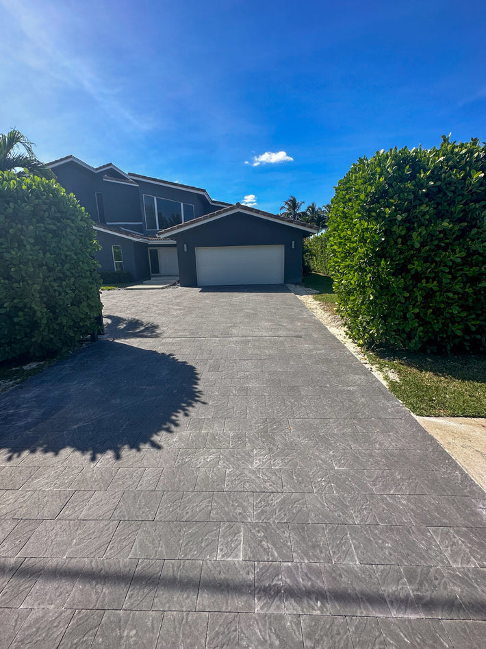 Brick driveway pavers installed for long-lasting function and beauty in a residential setting