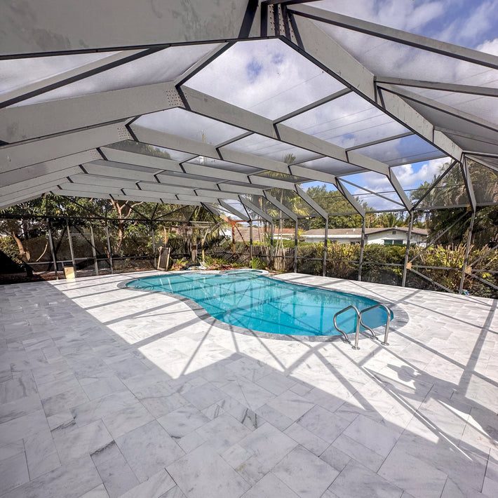 Natural stone decking built around pool area for a slip-resistant and stylish finish
